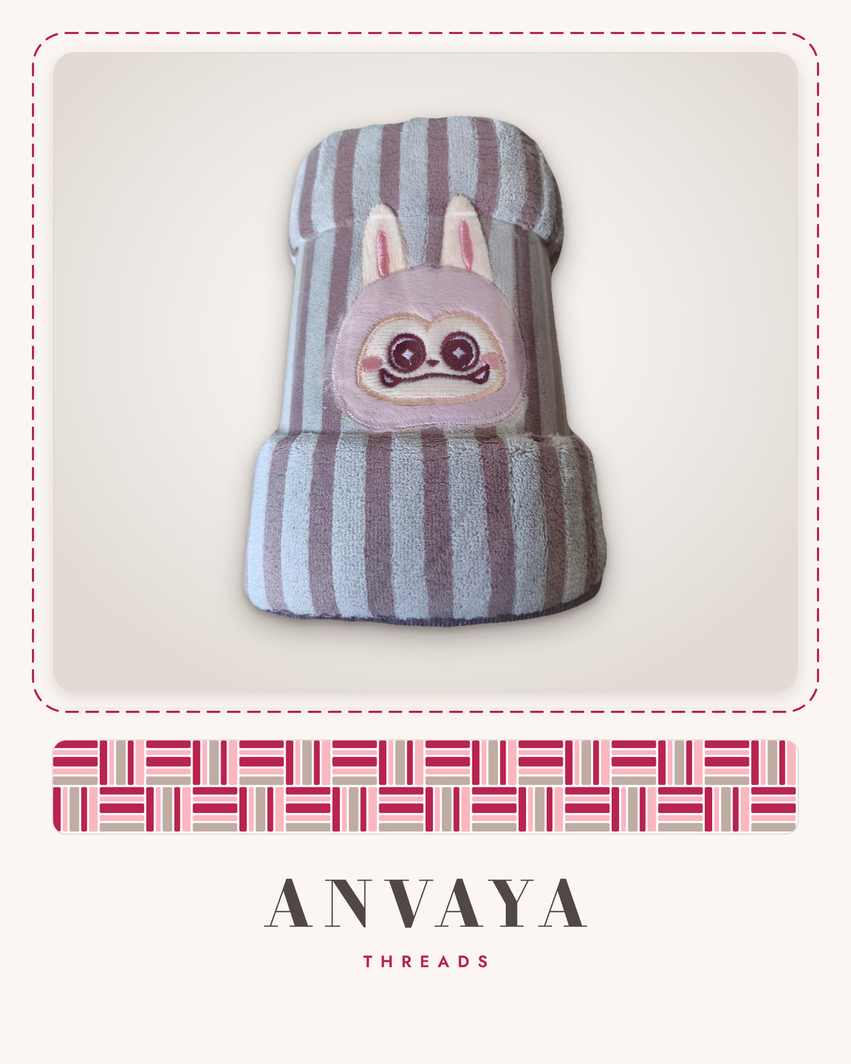Blush Stripe Bunny kids' hand towel, rolled in a clear wrap with a bunny patch