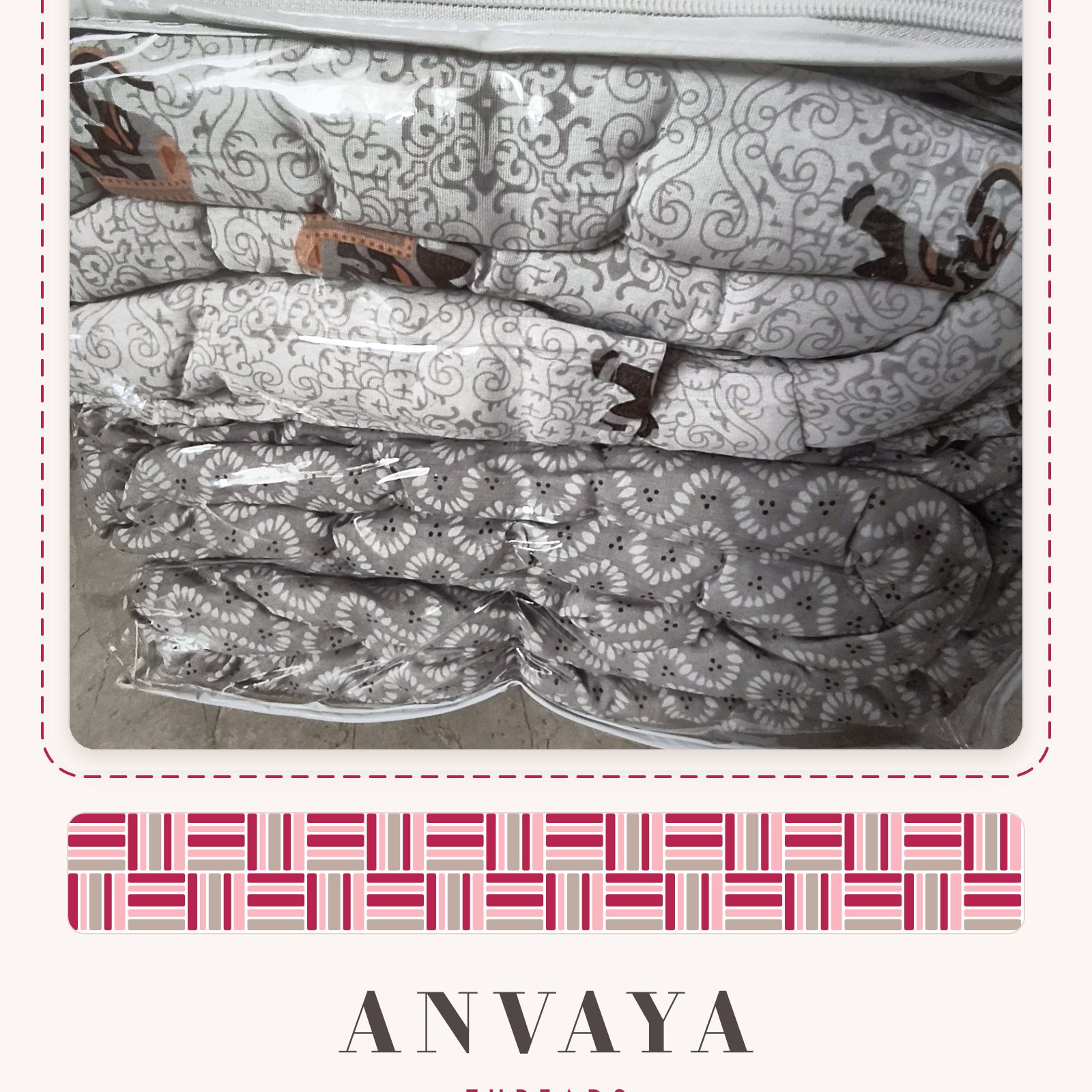 Elephant Jaal Grey comforter folded in its bag, with the grey reverse side showing